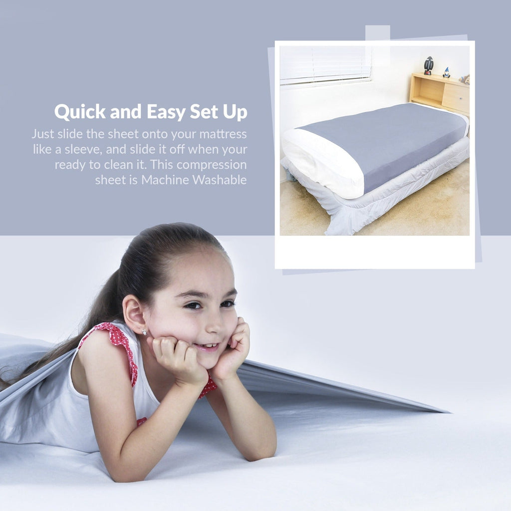 Child resting on a bed fitted with the JahBri sensory compression sheet for calming sleep support