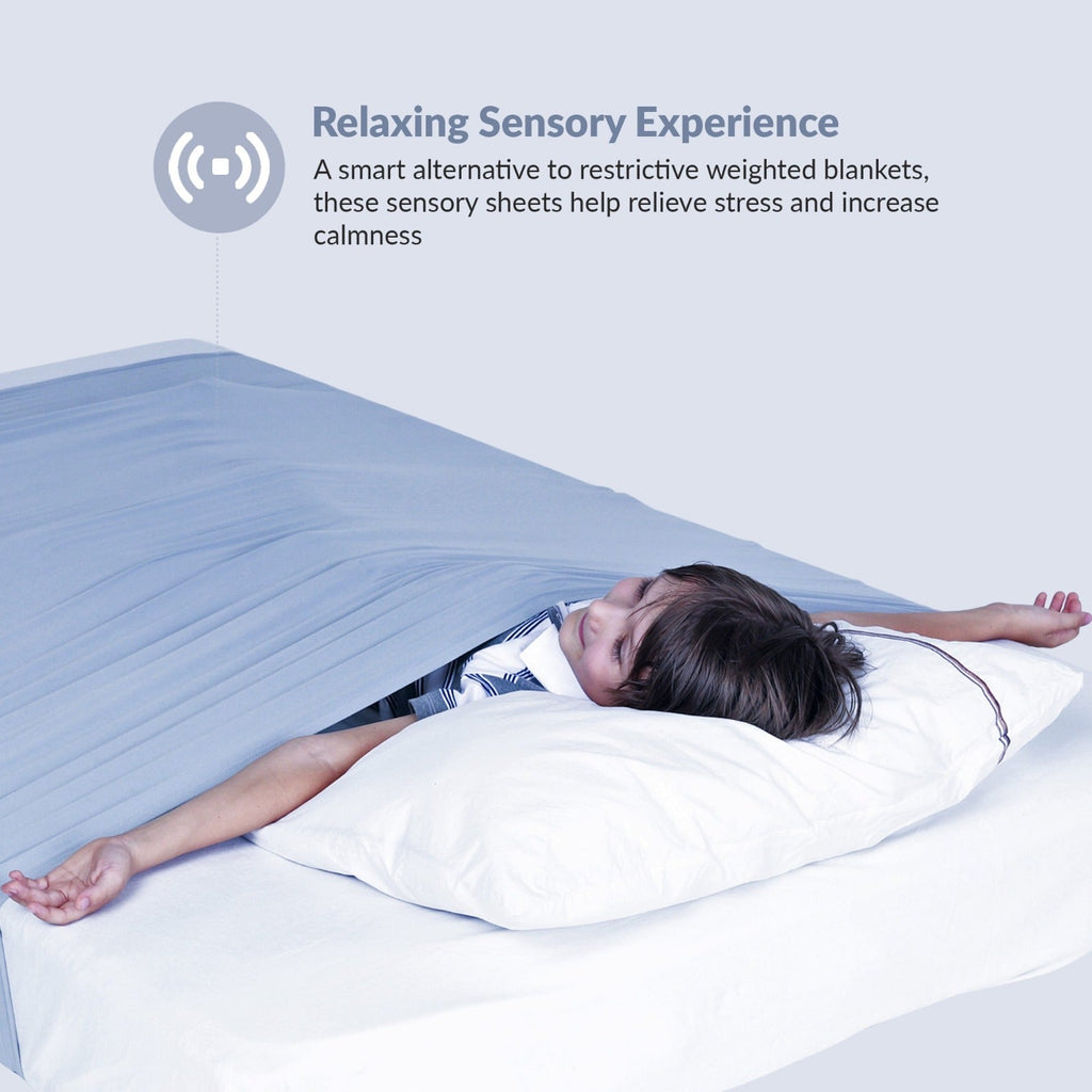 Child sleeping comfortably under the JahBri sensory compression bed sheet for deep-pressure calm