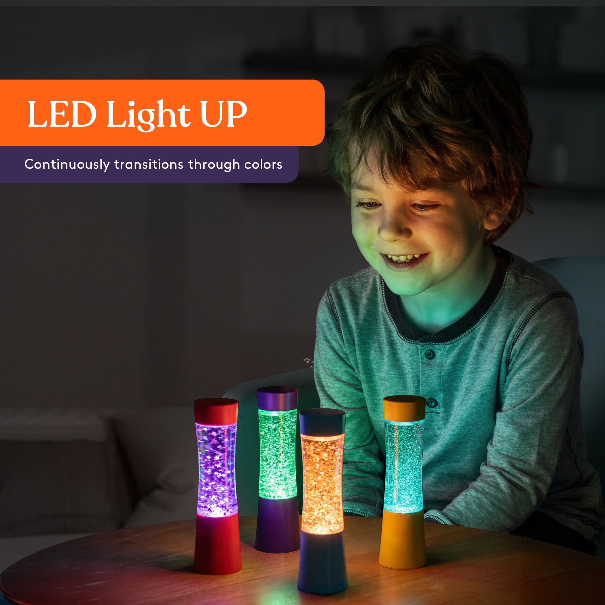 Child calming down using a light-up glitter sensory tube in a dark room