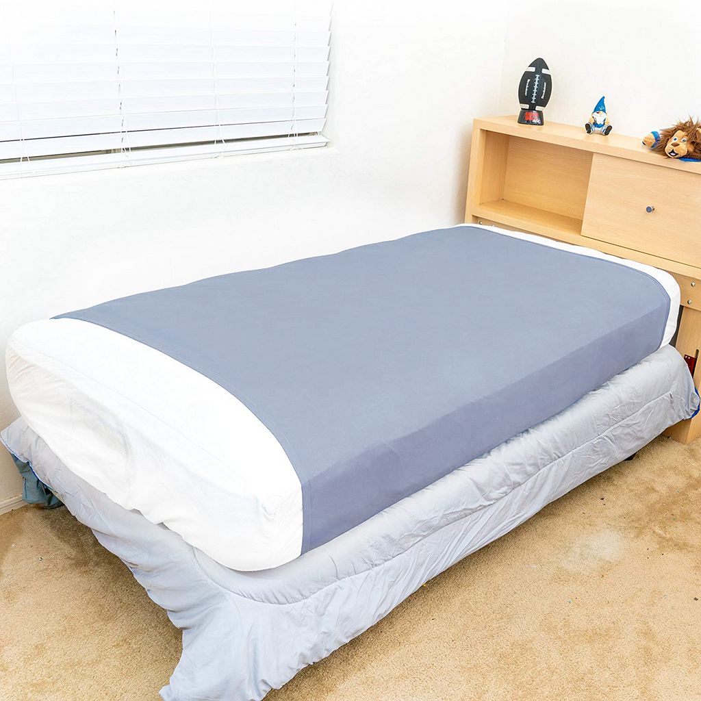 Diagram illustrating how the JahBri compression sheet wraps snugly around a child's mattress