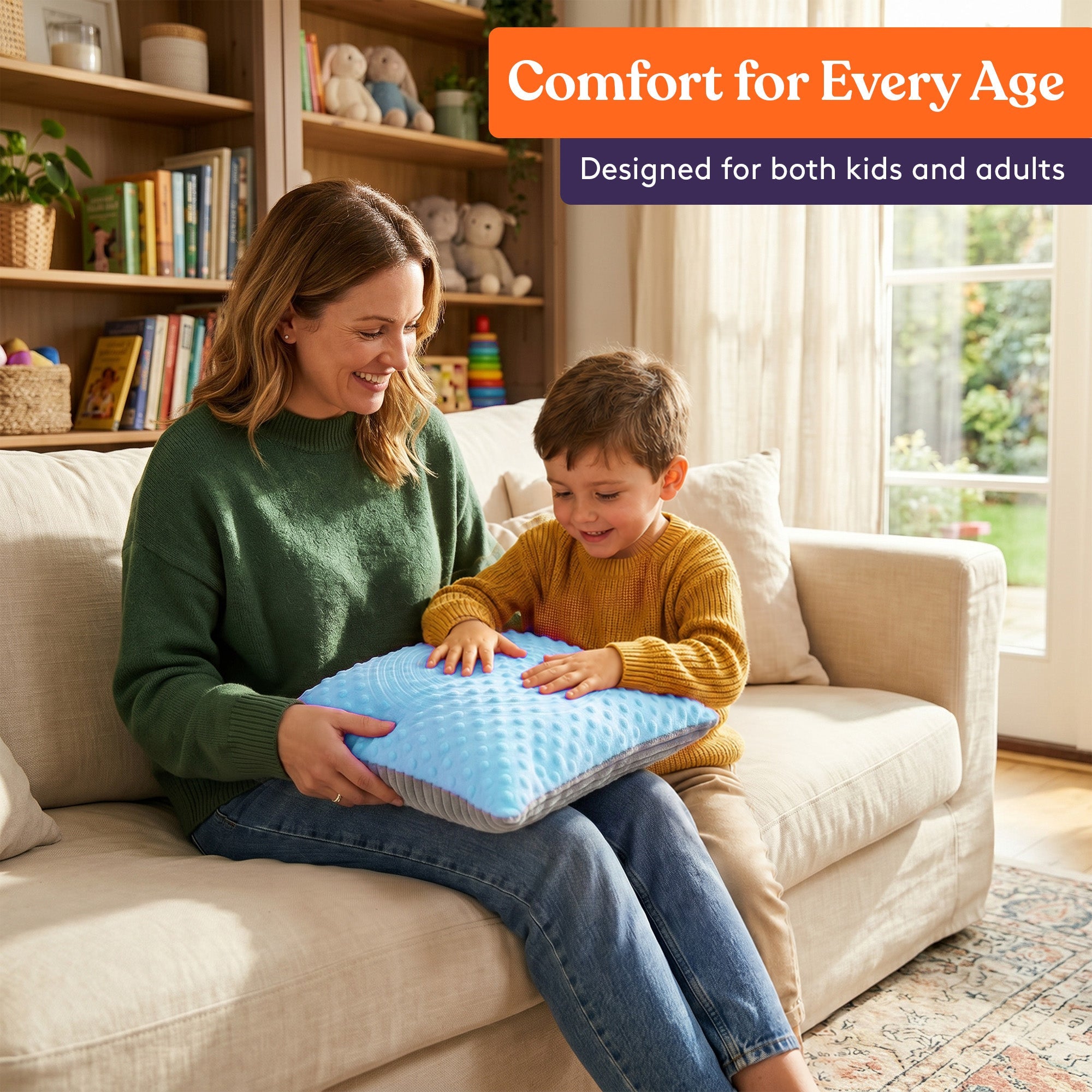 Mother and child sitting on a couch using the Sensory Vibrating Pillow – Pressure-Activated Calming Support for Kids & Adults, 12” Plush with Textured Bumps, 3 Vibration Modes, Music & Voice Recording (Blue) for comfort and relaxation.