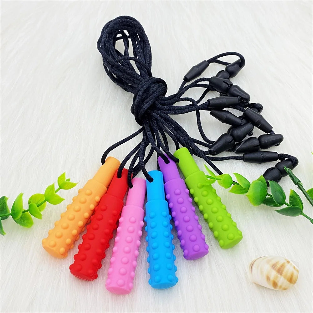 3PCS Sensory Chew Necklace A sensory oral aid teether toy for autism, hyperactivity, infant breastfeeding or special needs featuring colorful textured chewable pendants on black cords.