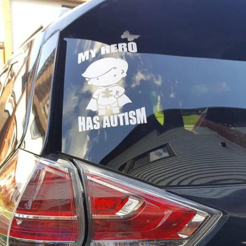 MY HERO HAS AUTISM Vinyl Decal Sticker For Car Truck Laptop Decorative Autism Awareness Decals showing a child superhero figure and supportive text on a vehicle window.
