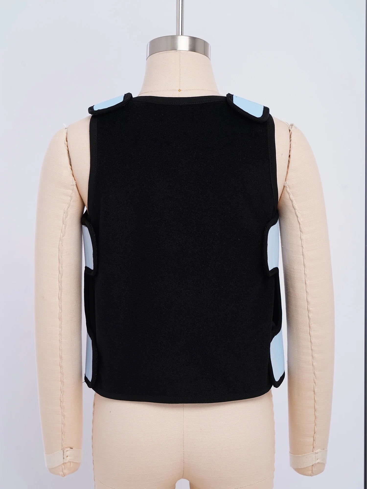Back view of a black and light blue Weighted Vest Kids Boys Girls Special Needs Adaptive Clothing Adjustable Fastener Sensory Compression Vest for Autism ADHD SPD on a mannequin.