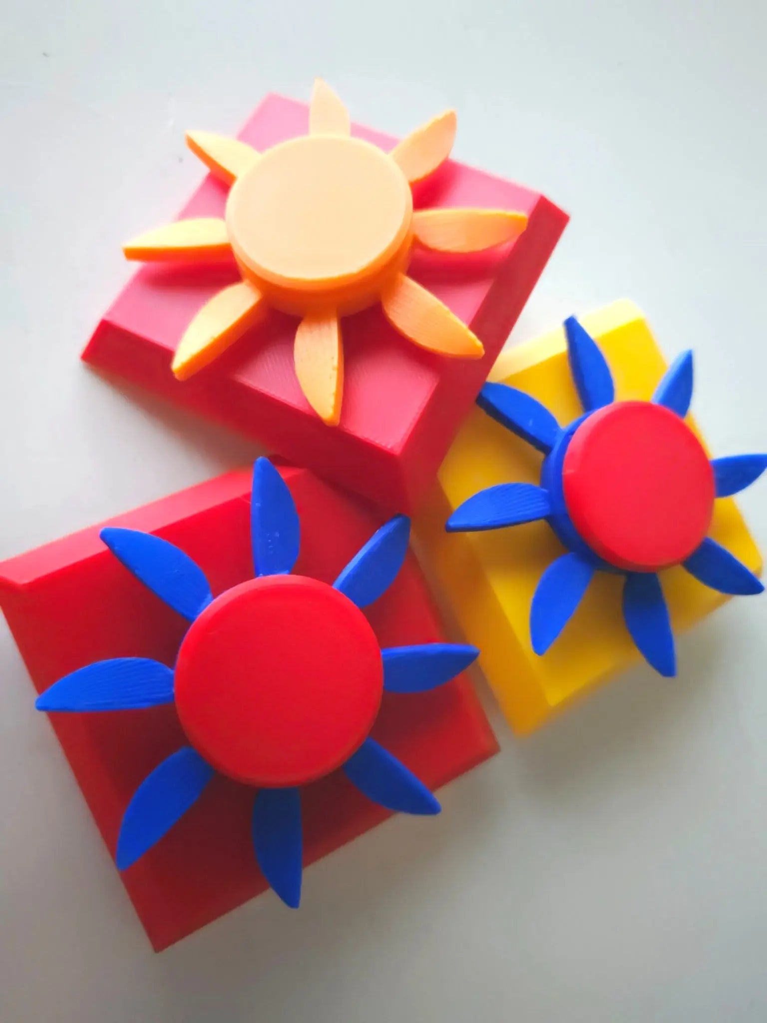 Brightly colored Modular Fidget Cube | Swappable Sensory Toy for Kids 4+ | 4 Inch with sun-shaped, removable pieces designed for sensory play and fine motor skill development.