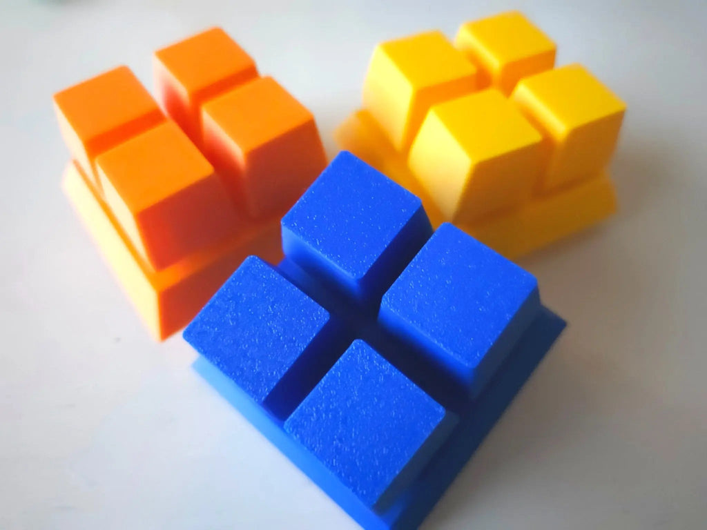 Three colorful Modular Fidget Cube | Swappable Sensory Toy for Kids 4+ | 4 Inch pieces in blue, orange, and yellow designed for sensory and fine motor skill development.