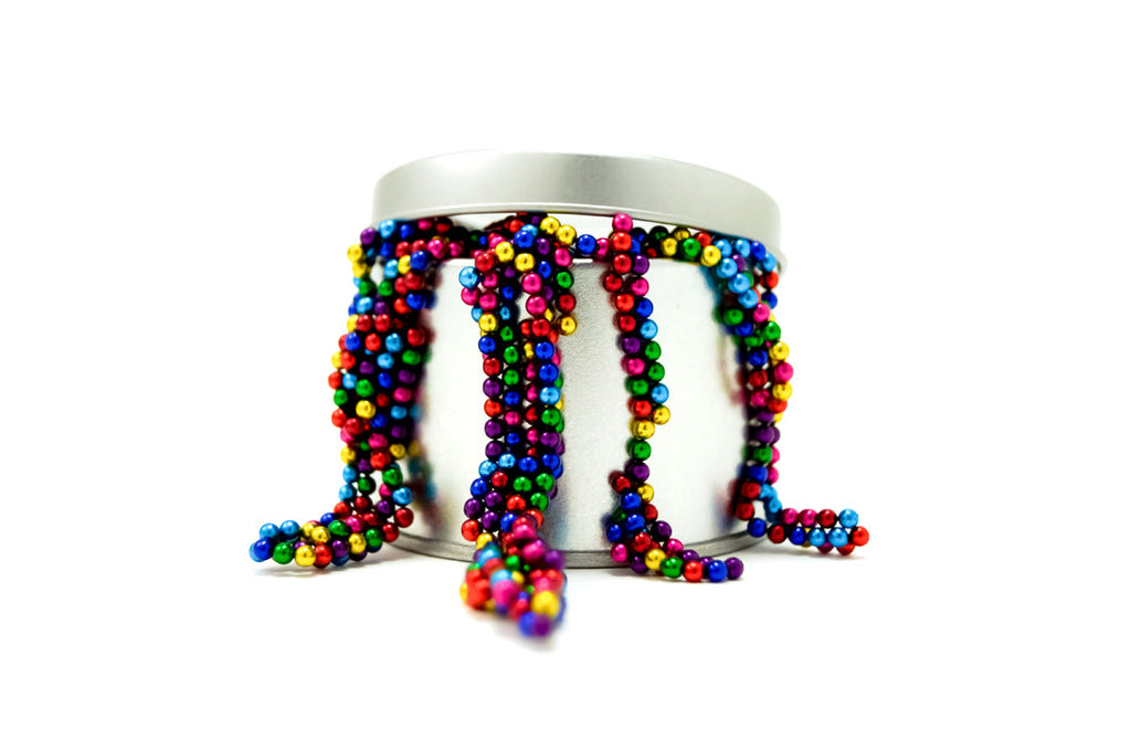 Brightly colored Magnetic Balls Fidget Toy | 3MM Neodymium Stress Relief Balls for Adults & Teens spilling from a silver container, designed for sensory and calming use.