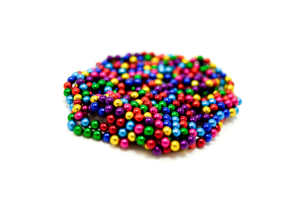 Colorful magnetic balls arranged in a flat cluster, demonstrating the Magnetic Balls Fidget Toy | 3MM Neodymium Stress Relief Balls for Adults & Teens for sensory and fine motor skill play.